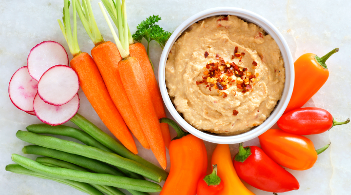 This recipe for hummus with Greek yogurt is a satisfying snack that’s good for your smile!